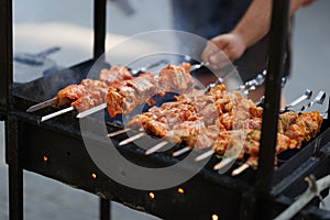 Bar-B-Q or BBQ with kebab cooking. Charcoal grill of meat skewers