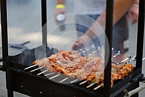 Bar-B-Q or BBQ with kebab cooking. Charcoal grill of meat skewers