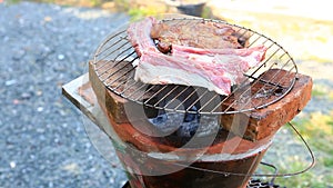 Bar-B-Q or BBQ with kebab cooking coal grill