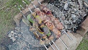 Bar-B-Q or BBQ with kebab cooking. coal grill of chicken meat skewers with mushroom and peppers. barbecuing dinner