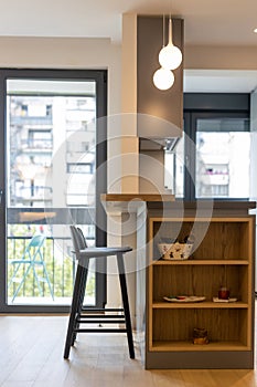 Bar counter and chairs in apartment kitchen