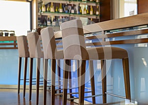 Bar counter with chairs in empty comfortable restaurant