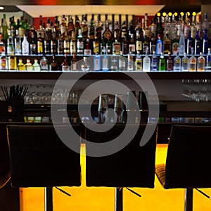 Bar counter with chairs in lounge pub