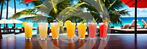 Bar counter with cocktails and a tropical beach in the background