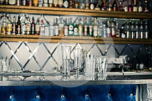 Bar counter with empty glasses. Assorted empty glasses and cocktail shots in the bar and restaurant. Glasses for alcoholic