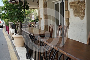 Bar counters are located on the street in Pefki, Rhodes Island, Greece