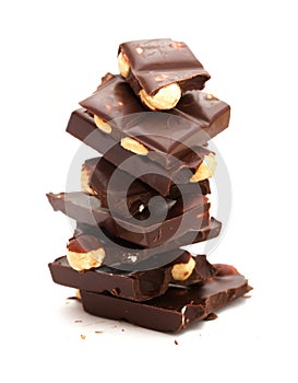 A bar of dark chocolate with hazelnuts