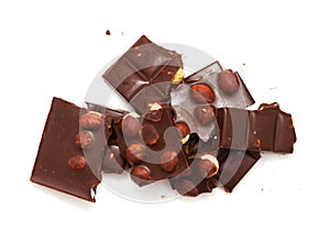 A bar of dark chocolate with hazelnuts