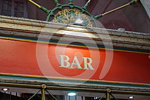 Bar french vintage sign text on retro facade wall pub in city street storefront building coffee entrance