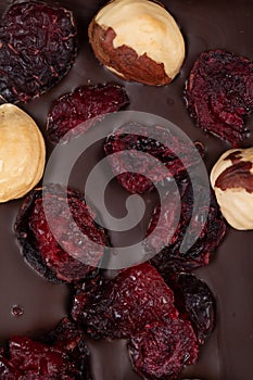 bar of natural dark bitter chocolate with natural whole hazelnuts and cranberries