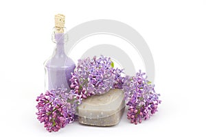 Bar of natural soap, bath salt and lilac flowers