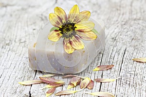 Bar of natural soap and flower