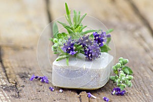 Bar of natural soap and lavender flowers