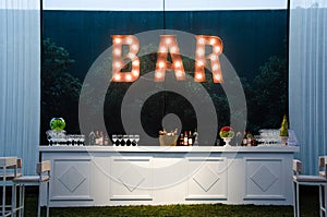 The bar is an open sign, the wooden bar painted white for a wedding, the concept of decoration