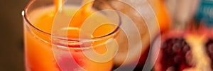 Bar orange and pomegranade fruit drink closeup