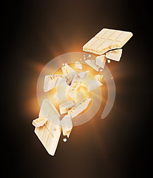 A bar of porous white chocolate broken in the air with flash of light in the dark