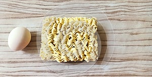 A bar of raw noodle and chicken egg photo