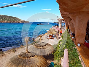 The bar restaurant and bazaar in cala comte nestled in the cliff rock