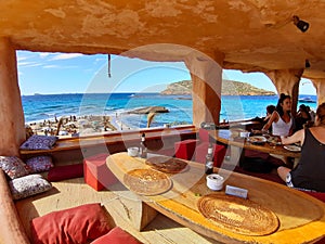 The bar restaurant and bazaar in cala comte nestled in the cliff rock