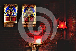 Bar scene, lustres in red and glass stained window