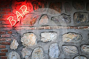 Bar sign on a stone wall