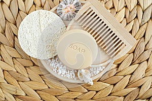 Bar of soap solid shampoo, loofah bath sponge and wooden hairbrush comb. Eco friendly toiletries set. Natural beauty treatment