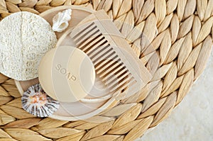 Bar of soap solid shampoo, loofah bath sponge and wooden hairbrush comb. Eco friendly toiletries set. Natural beauty treatment