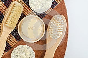 Bar of soap, wooden hair brush and body massage brush. Eco friendly toiletries. Natural beauty treatment, skin-care or zero waste