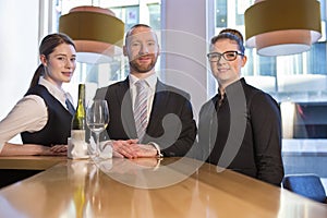 Bar staff posing at work