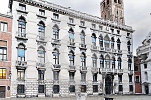 : Bar terrace in the square called `Campo San Geremia`, with the palace called `palazzo Labia` photo