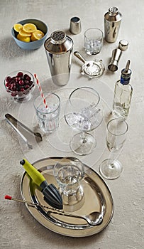 Bar tools, Shaker and cocktail glasses, mixology tools on a white table, close up