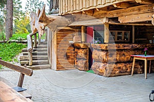 Bar under a log cabin at a glamping site at Lake Bloke in Nova Vas, Slovenia photo