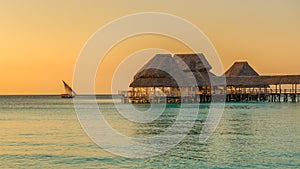 Bar on water at sunset in Zanzibar, Tanzania