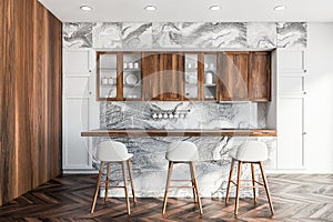 Bar in white marble and wooden kitchen