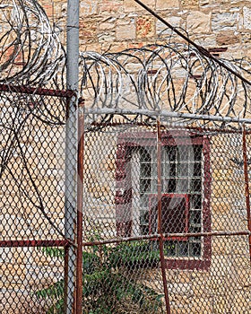 Barb wire on top of cyclone fence