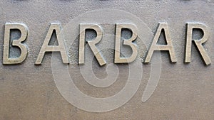 Barbar - inscription on the wall of metal letters