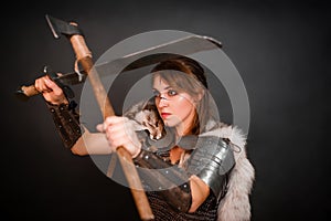 Barbarian woman warrior in chainmail armor with bracers, armor shoulder pad, polar fox fur on her shoulders