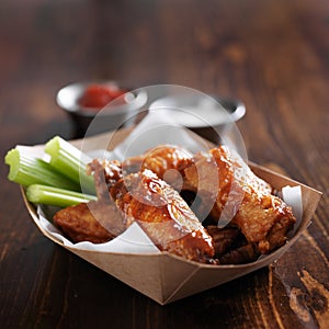 Barbecue buffalo chicken wings in container