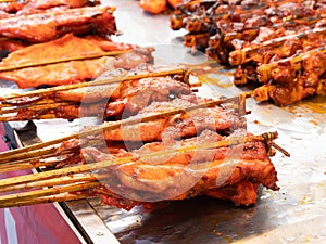 Barbecue chicken at a market in Thailand