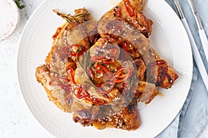 Barbecue chicken wings. Slow cooker sweet and spicy. Oven baked marinated chiken on plate