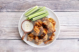 Barbecue chicken wings on a white plate
