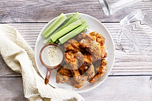 Barbecue chicken wings on a white plate