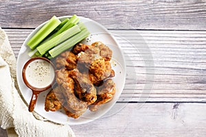 Barbecue chicken wings on a white plate