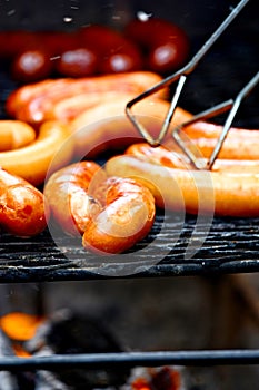 Barbecue. Close up of grilled sausages on wire rack