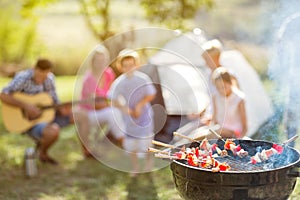 Barbecue and family on camping