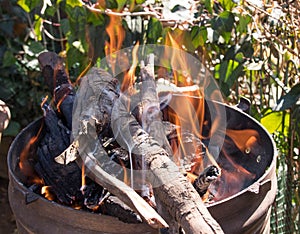 A barbecue fire to prepare coals for outdoor cooking
