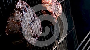 Barbecue fresh beef meat with blood steak serving delicious food dinner lunch pierce with skewer moving live practically