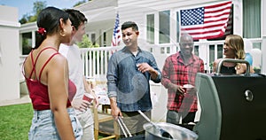Barbecue, friends and celebration at 4th of July party, conversation and celebrating independence day in outdoors