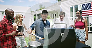 Barbecue, friends and talking at independence day party, grill and celebrating patriotism in outdoors. People, bbq and