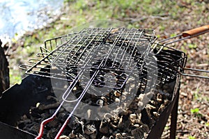 Barbecue grates and a grill with coals